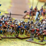 Miniaturefigurer i kamp